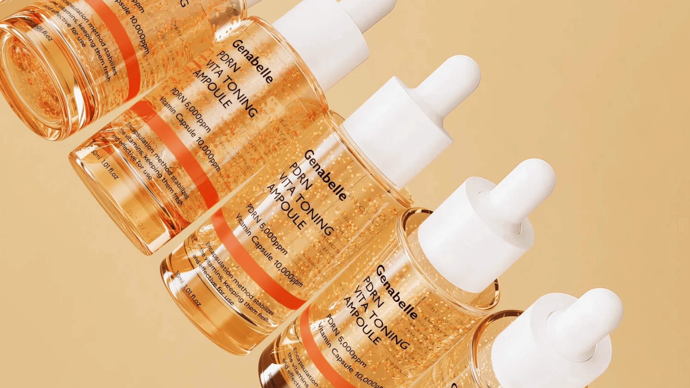 Genabelle PDRN Vita Toning Ampoule med gyllene serum och vitaminkapslar i transparent glasflaska mot beige bakgrund, lystergivande koreanskt serum för glow och jämn hudton.