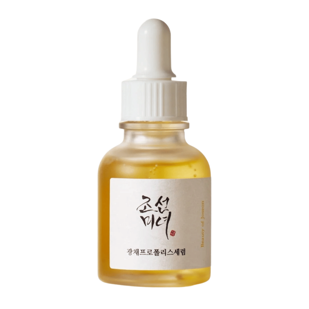 Μπουκάλι από Beauty of Joseon Glow Serum με λευκή πιπέτα και χρυσόχρωμο ορό, ένα προϊόν που προσδίδει λάμψη με πρόπολη και νιασιναμίδη.