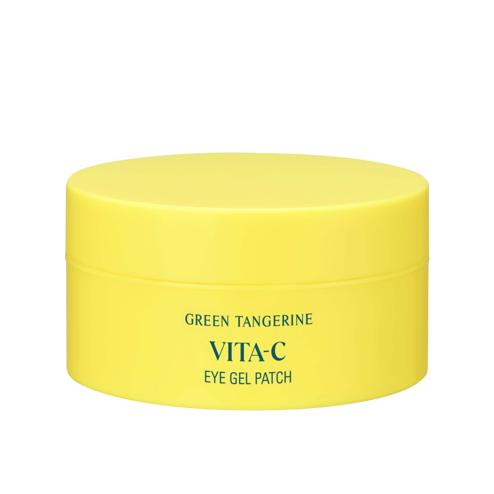 Ένα κίτρινο βαζάκι με την ετικέτα "GREEN TANGERINE VITA-C EYE GEL PATCH" πιθανώς μάσκες ματιών που περιέχουν βιταμίνη C.