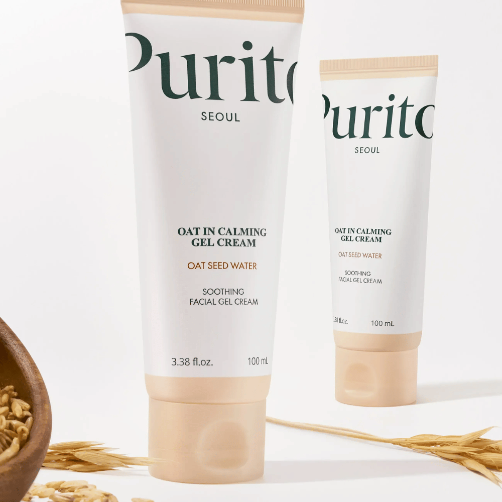 Purito Oat-In Calming Gel Cream σε μπεζ σωληνάριο, τοποθετημένο με σπόρους βρώμης. Καταπραΰνει ευαίσθητο δέρμα με νερό βρώμης και ελαφριά υφή τζελ.