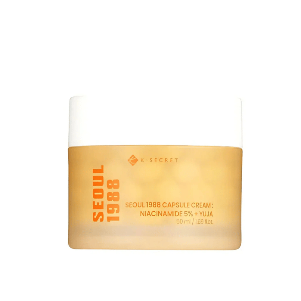 Βάζο με K-Secret Seoul 1988 Capsule Cream Niacinamide 5% + Yuja, 50 ml, σε χρυσόχρωμη σχεδιασμένη συσκευασία.
