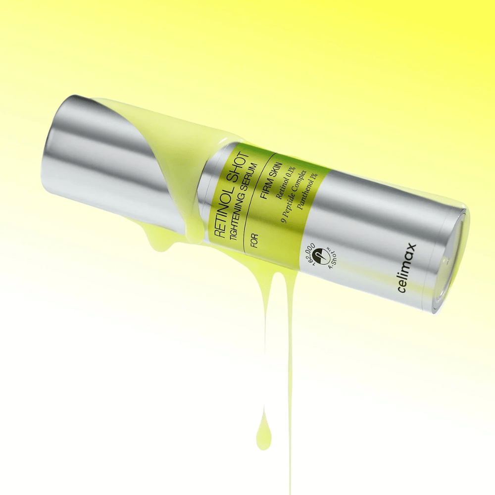 Εικόνα προϊόντος του The Vita-A Retinol Shot Tightening Serum από Celimax με κίτρινο ορό που ρέει κατά μήκος του μπουκαλιού σε ανοιχτό κίτρινο φόντο.
